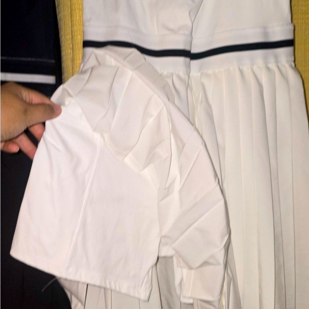 White tennis dress shorts under pocket for phone